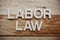 Labor Law alphabet letters on wooden background