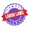 LABOR LAWS text on red violet ribbon stamp