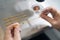 Laboratory assistant places the biomaterial into straw for the embryo