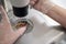 Laboratory assistant places the embryos in special straw for vitrification