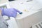 Laboratory assistant presses the button on immunochemiluminescent analyzer