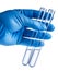 Laboratory beakers in analyst`s hand in plastic glove.