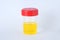 Laboratory can with red cap of urine tests on a white background