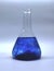 Laboratory conical flask with dark blue liquid