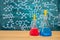 Laboratory glassware with blackboard background with various chemical formulas