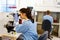 Laboratory staff looking at samples in microscope