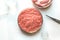 Laboratory studies of artificial meat. Minced meat in glass Petri dish. Top view. Chemical experiment