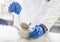 Laboratory technician performs an experiment with liquid nitrogen