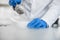 Laboratory technician performs an experiment with liquid nitrogen