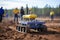 A laboratory technician takes a soil sample for analysis. Remote control drone for demining.