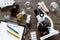 Laboratory test. Microscope, pills, test tube on wooden background top view