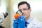 Laboratory worker examining fruits and vegetables and making analysis for pesticides and nitrates.