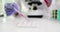 Laboratory worker in gloves drips pink reagent with pipette
