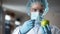 Laboratory worker injecting apple with chemicals, adding smell and juiciness