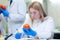 Laboratory workers examining fruits and vegetables and making analysis for pesticides and nitrates.