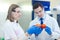 Laboratory workers examining fruits and vegetables and making analysis for pesticides and nitrates.