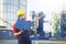 Laborer outside a factory working dressed with safety overalls e