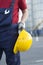 Laborer outside a factory working equipment