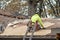 Laborer repairs a roof on an old home