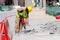 A laborer uses a jackhammer to break up a concrete pavement