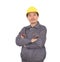 Laborer in yellow hard hat holding his arms standing in front of white background