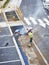 Laborers applying asphalt during the works for the pavement of a