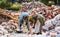 Laborers loading chunks of rock salt