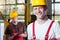 Laborers in overalls and hardhat