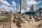 Laborers work at the construction site of a building.