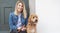 Labradoodle Dog and woman outside on balcony