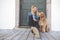 Labradoodle Dog and woman outside on balcony