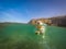 Labrador dog swimming with a frisbee Curacao views