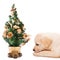 Labrador puppy with a small Christmas tree