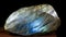 Labradorite is rare precious natural geological stone on gradient background in low key, isolate. AI generated.