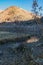 Labrinth of water through grassy shoreline with ice