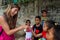 LABUAN BAJO, INDONESIA - Dec 11, 2014: Indonesian children with a Caucasian tourist portrait`on the street