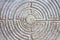 Labyrinth carved on the stone facade of a Romanesque church of the 11th century Tuscany - Italy