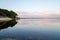 Lacanau lake sunrise with sandy beach forest in nature Gironde france