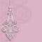 Lace pendant on ornamental pink background