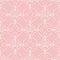 Lace seamless pattern of crochet loops. Openwork white on a pink background.
