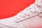 Laced fastening of new sports shoe close-up. Elastic laces of modern textile trainers for active lifestyle, sport, and fitness on