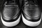 Lacing black shoes. Detailed macro photo.