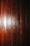 Lacquer varnish wooden panels. Dark brown natural wood background texture