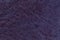 Lacquered dark violet leather texture background, closeup. navy blue backdrop