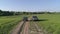 Lada Niva and Mitsubishi Pajero Sport. Cars drive across the field.