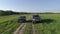 Lada Niva and Mitsubishi Pajero Sport. Cars drive across the field.