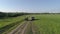 Lada Niva and Mitsubishi Pajero Sport. Cars drive across the field.