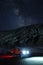 Ladakh, India - August 24th, 2022: Extreme long exposure image showing Milkyway Galaxy over an SUV offroad vehicle in the