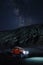 Ladakh, India - August 24th, 2022: Extreme long exposure image showing Milkyway Galaxy over an SUV offroad vehicle in the