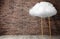 Ladder with cloud near brick wall, space for text . Conceptual design